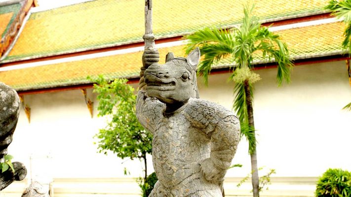 Statue in the courtyard of Wat Suthat Thepwararam.
